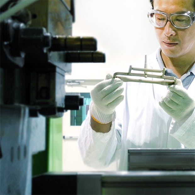 Victrex lab workers inspecting PEEK product 