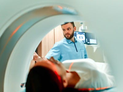 Doctor initiating a MRI scan 